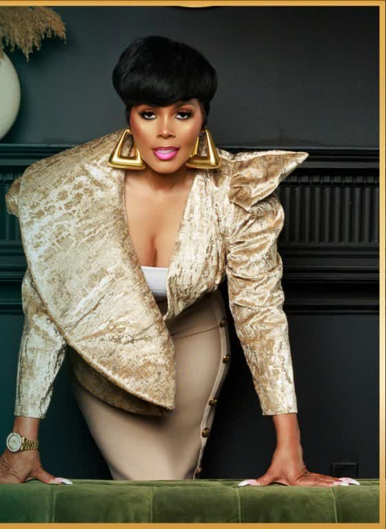 Joi Hunt in a gold jacket